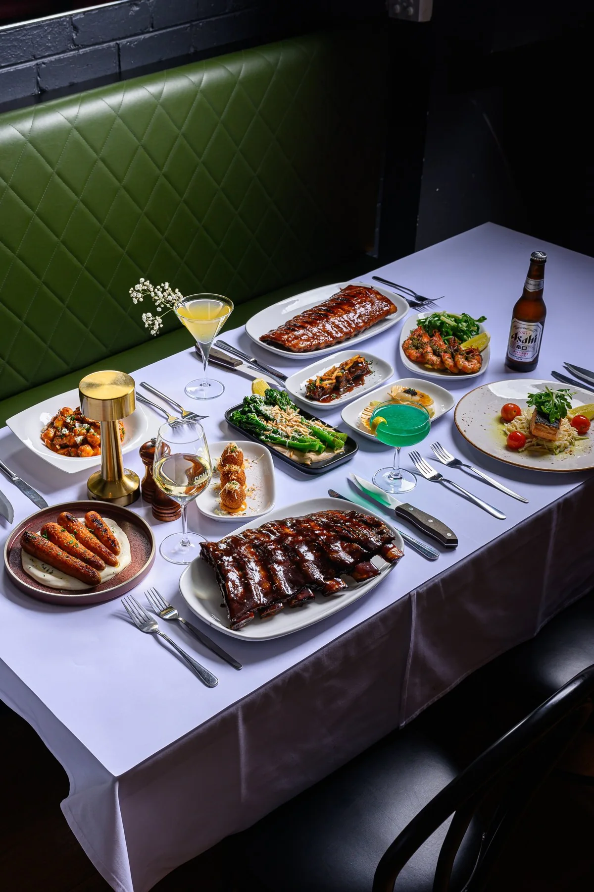 Dishes and drinks on a table at Sam’s Steakhouse